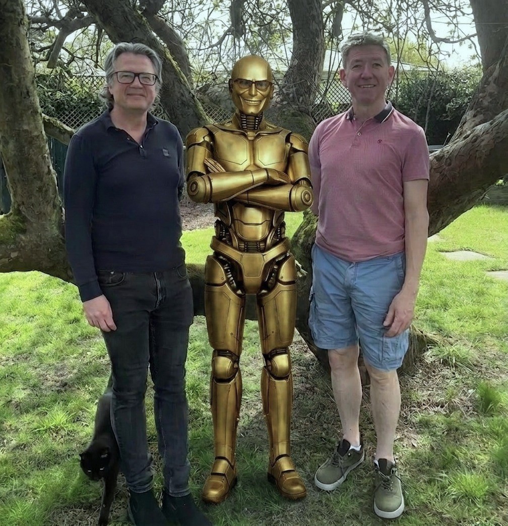 Jeremy and James with IFAgent's golden robot mascot